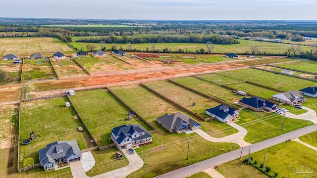birds eye view of property with a rural view