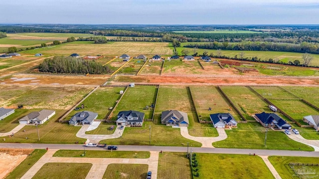 birds eye view of property with a rural view