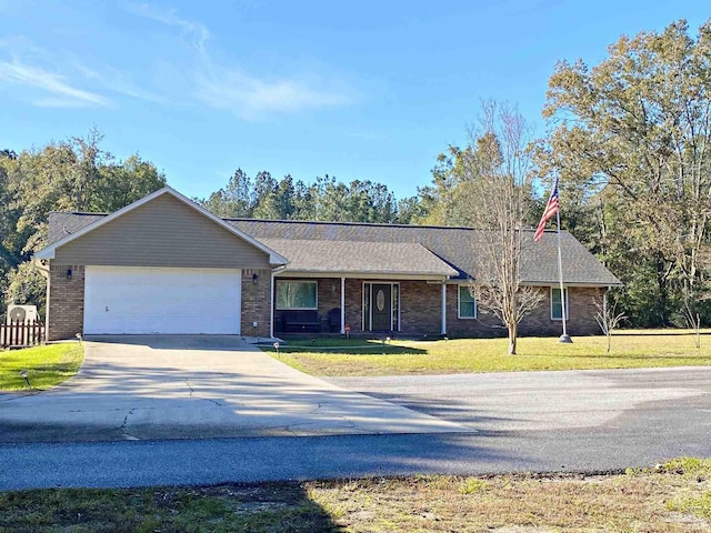 ranch-style home with a garage and a front yard