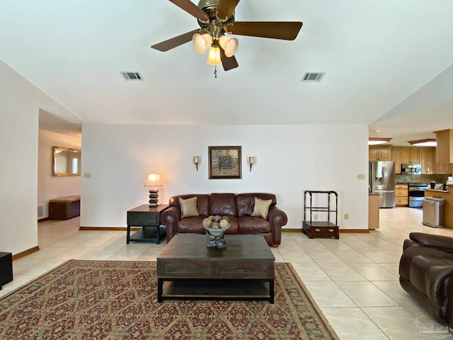 living room featuring light tile patterned floors and ceiling fan