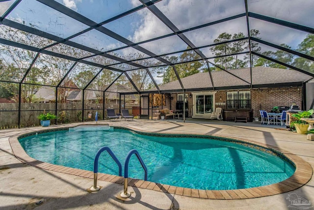 view of pool with a lanai and a patio area