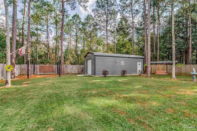 view of yard with an outdoor structure and a garage