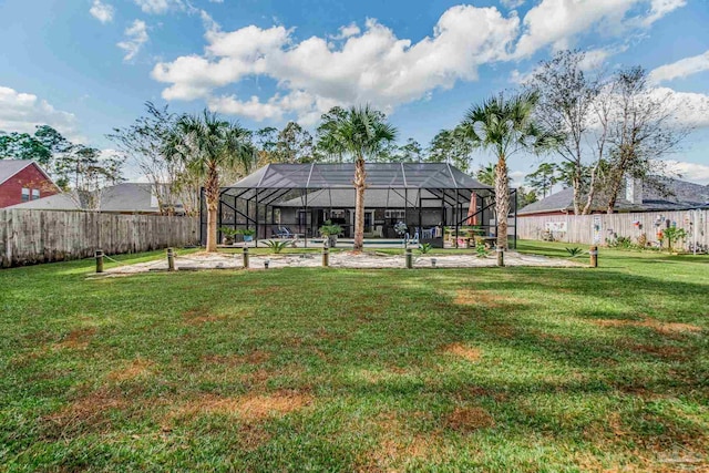 view of yard with a patio area and a lanai