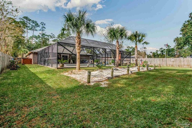 view of yard with a lanai