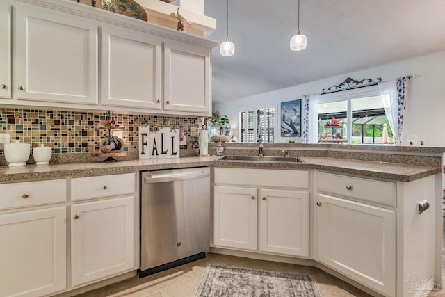 kitchen featuring dishwasher, sink, white cabinets, pendant lighting, and light tile patterned flooring