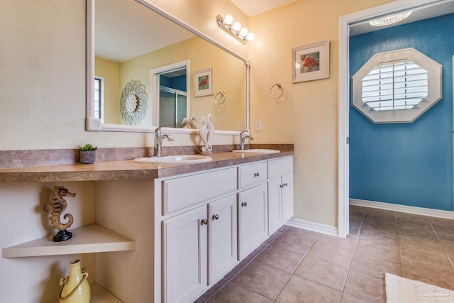 bathroom featuring tile patterned flooring and vanity