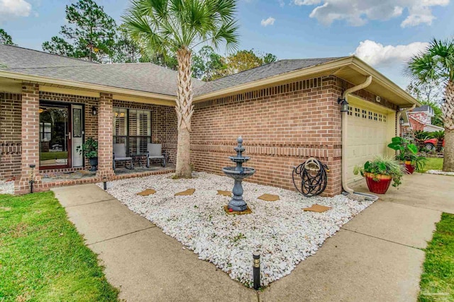 exterior space with a porch and a garage