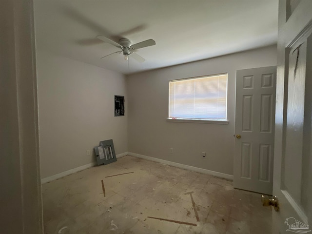 unfurnished bedroom with ceiling fan and baseboards