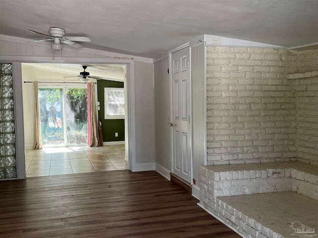 hallway with baseboards and wood finished floors