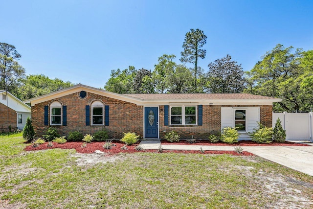 3941 Baybrook Dr, Pace, FL 32571 - single story home with brick siding, a front lawn, and fence
