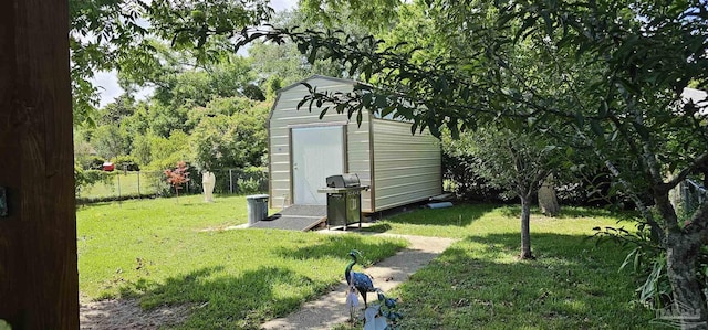 view of outdoor structure featuring a yard