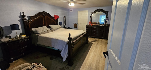 bedroom featuring ceiling fan and light hardwood / wood-style floors