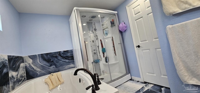 bathroom featuring separate shower and tub