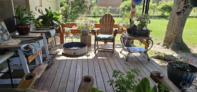 wooden deck featuring a fire pit