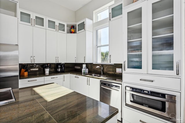 kitchen featuring sink, plenty of natural light, white cabinets, and appliances with stainless steel finishes