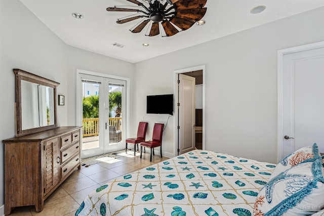 tiled bedroom featuring access to exterior, french doors, connected bathroom, and ceiling fan