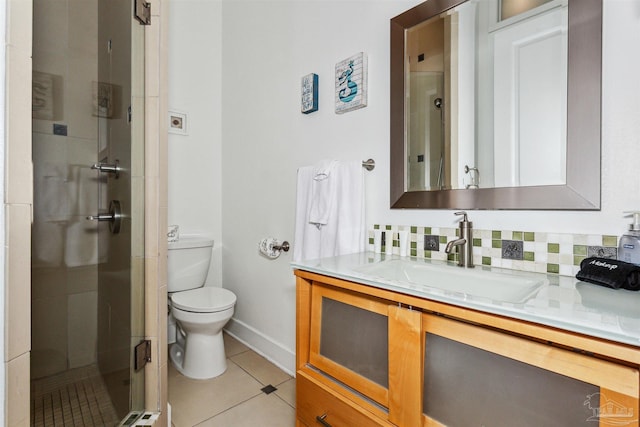 bathroom with walk in shower, backsplash, tile patterned floors, toilet, and vanity