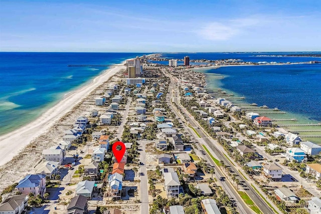 birds eye view of property featuring a water view and a view of the beach