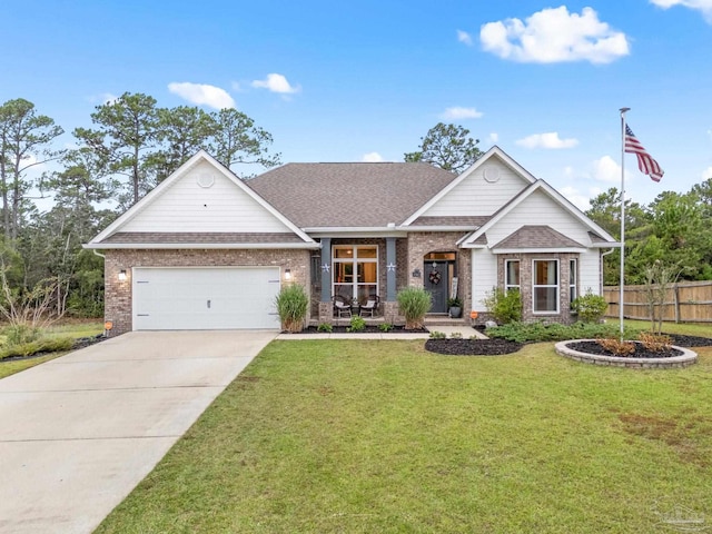 view of front of property with a garage and a front lawn