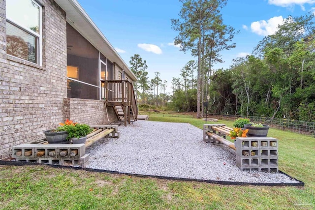 view of yard featuring a sunroom