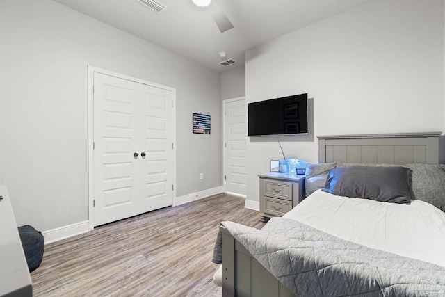 bedroom featuring a closet, ceiling fan, and light hardwood / wood-style floors