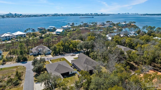 drone / aerial view featuring a water view and a residential view