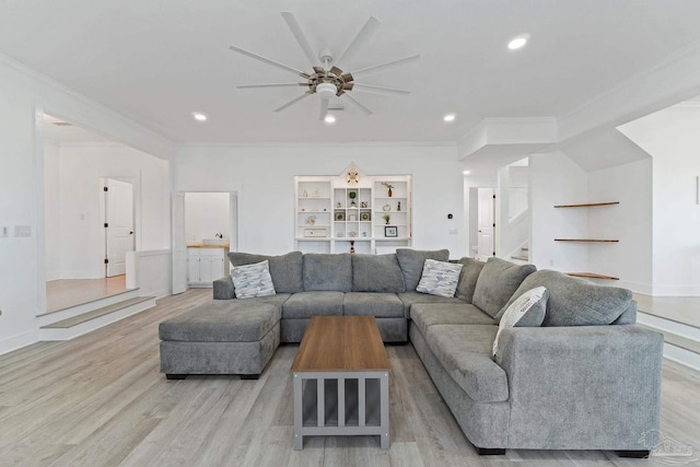 living room with ceiling fan, light hardwood / wood-style flooring, and ornamental molding