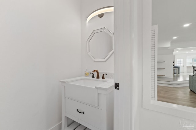 bathroom featuring hardwood / wood-style floors and vanity