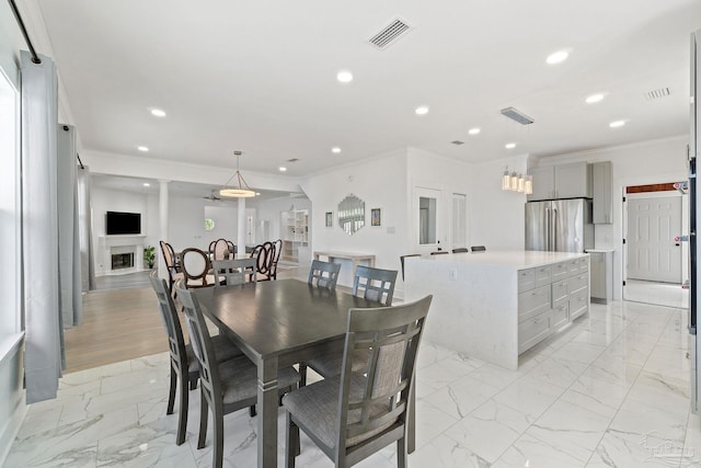 tiled dining space with ornamental molding