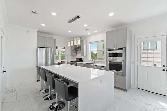 kitchen featuring plenty of natural light, appliances with stainless steel finishes, light tile patterned floors, and gray cabinetry