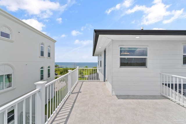 balcony featuring a water view