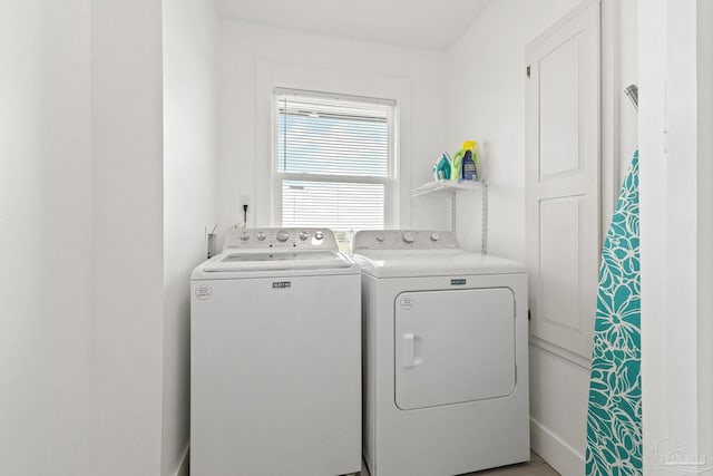 washroom featuring washer and clothes dryer