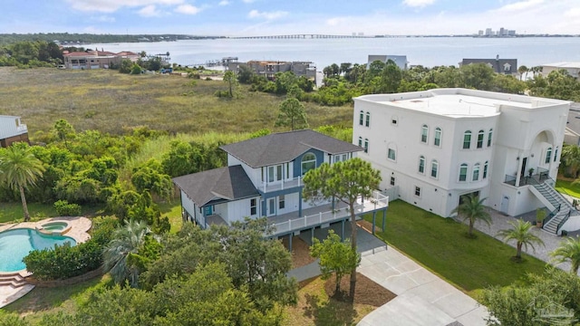 birds eye view of property with a water view