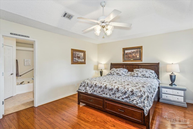 bedroom with hardwood / wood-style flooring and ceiling fan