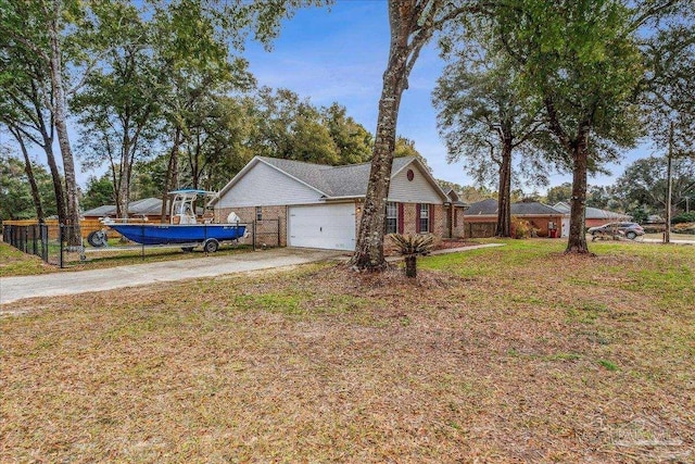 view of front of house with a garage and a front lawn