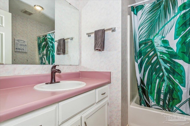 bathroom with vanity and shower / bath combo