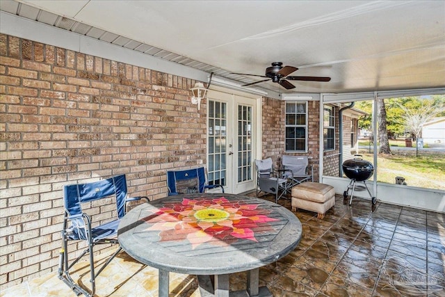 sunroom / solarium with french doors and ceiling fan