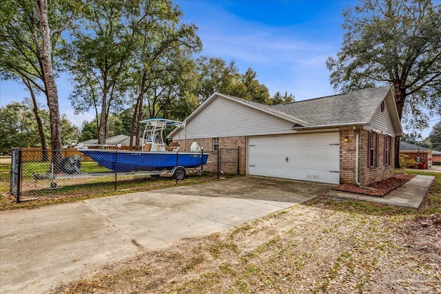 view of side of home featuring a garage