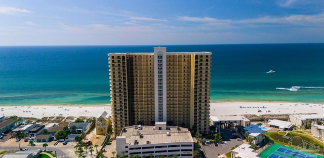 birds eye view of property featuring a water view and a view of the beach