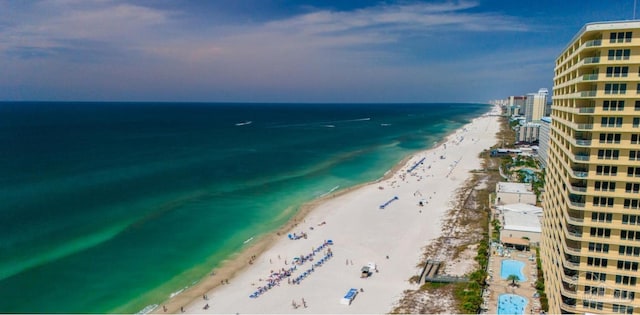 birds eye view of property featuring a water view and a view of the beach