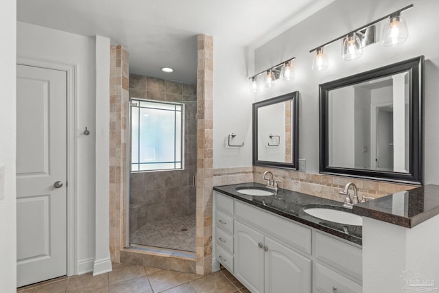 5473 Tucker Cir, Pace, FL 32571 - bathroom featuring a shower stall, double vanity, and tile patterned floors