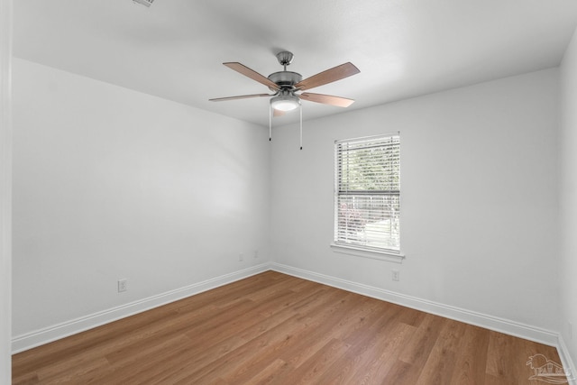 5473 Tucker Cir, Pace, FL 32571 - unfurnished room featuring light wood-style flooring, baseboards, and a ceiling fan