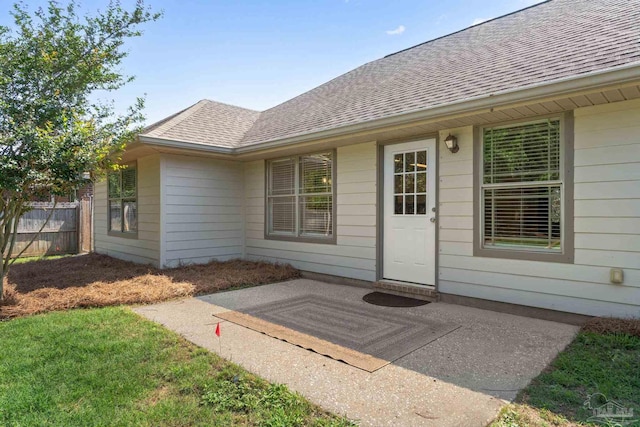 5473 Tucker Cir, Pace, FL 32571 - entrance to property with a shingled roof and a patio
