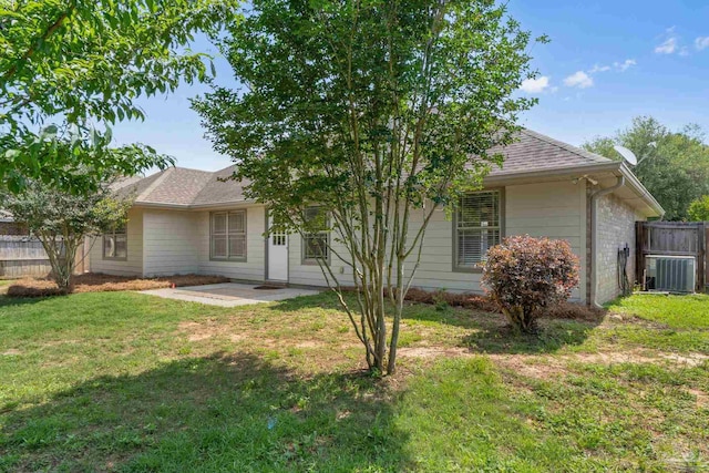 5473 Tucker Cir, Pace, FL 32571 - view of front of home featuring a patio area, a shingled roof, and central AC