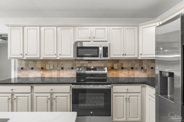 5473 Tucker Cir, Pace, FL 32571 - kitchen with appliances with stainless steel finishes, tasteful backsplash, and dark stone countertops