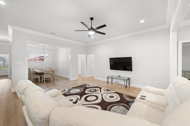 3041 Mountain Laurel Trl, Cantonment, FL 32533 - living area with baseboards, ornamental molding, ceiling fan with notable chandelier, and wood finished floors