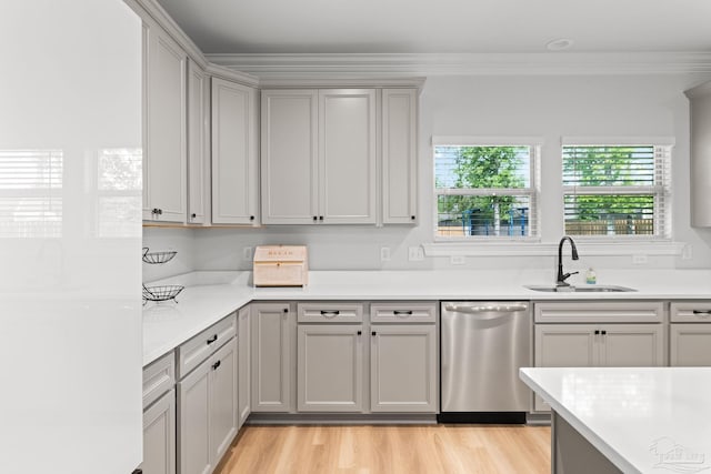 3041 Mountain Laurel Trl, Cantonment, FL 32533 - kitchen featuring a sink, light countertops, stainless steel dishwasher, and light wood finished floors