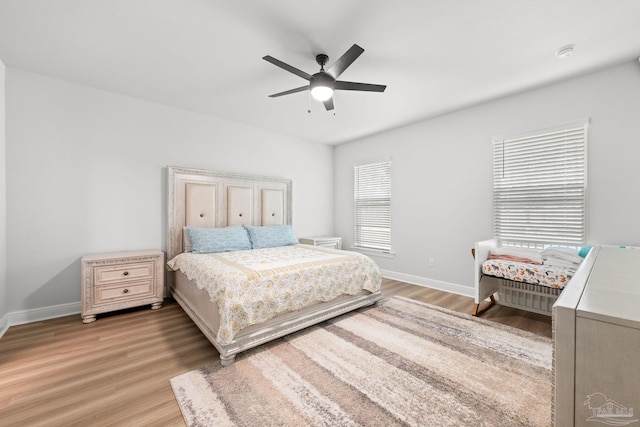 3041 Mountain Laurel Trl, Cantonment, FL 32533 - bedroom featuring a ceiling fan, baseboards, and light wood-type flooring
