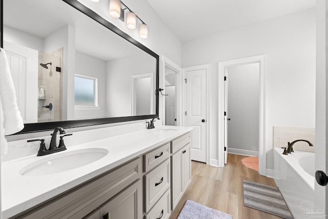 3041 Mountain Laurel Trl, Cantonment, FL 32533 - full bath with double vanity, a shower stall, a sink, and a garden tub