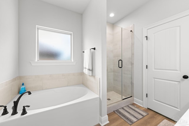 3041 Mountain Laurel Trl, Cantonment, FL 32533 - bathroom with recessed lighting, a shower stall, wood finished floors, and a bath